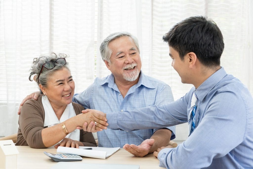 Leading Edge Title refinancing expert helping elderly couple with their refi