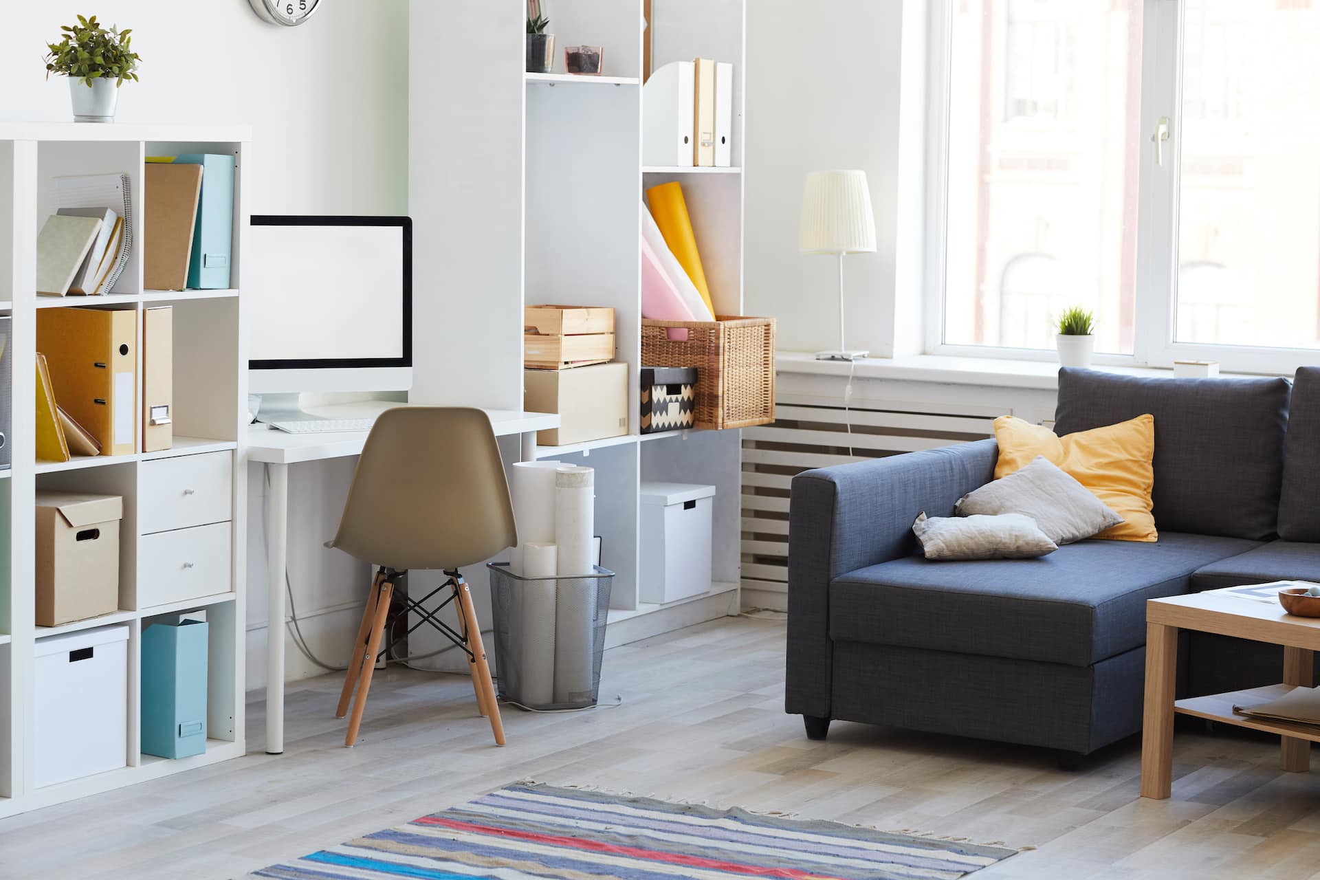 Domestic interion in white and blue with home workplace in living room, copy space