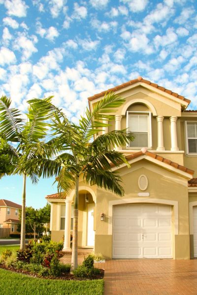 Beautiful home with palm trees in the front
